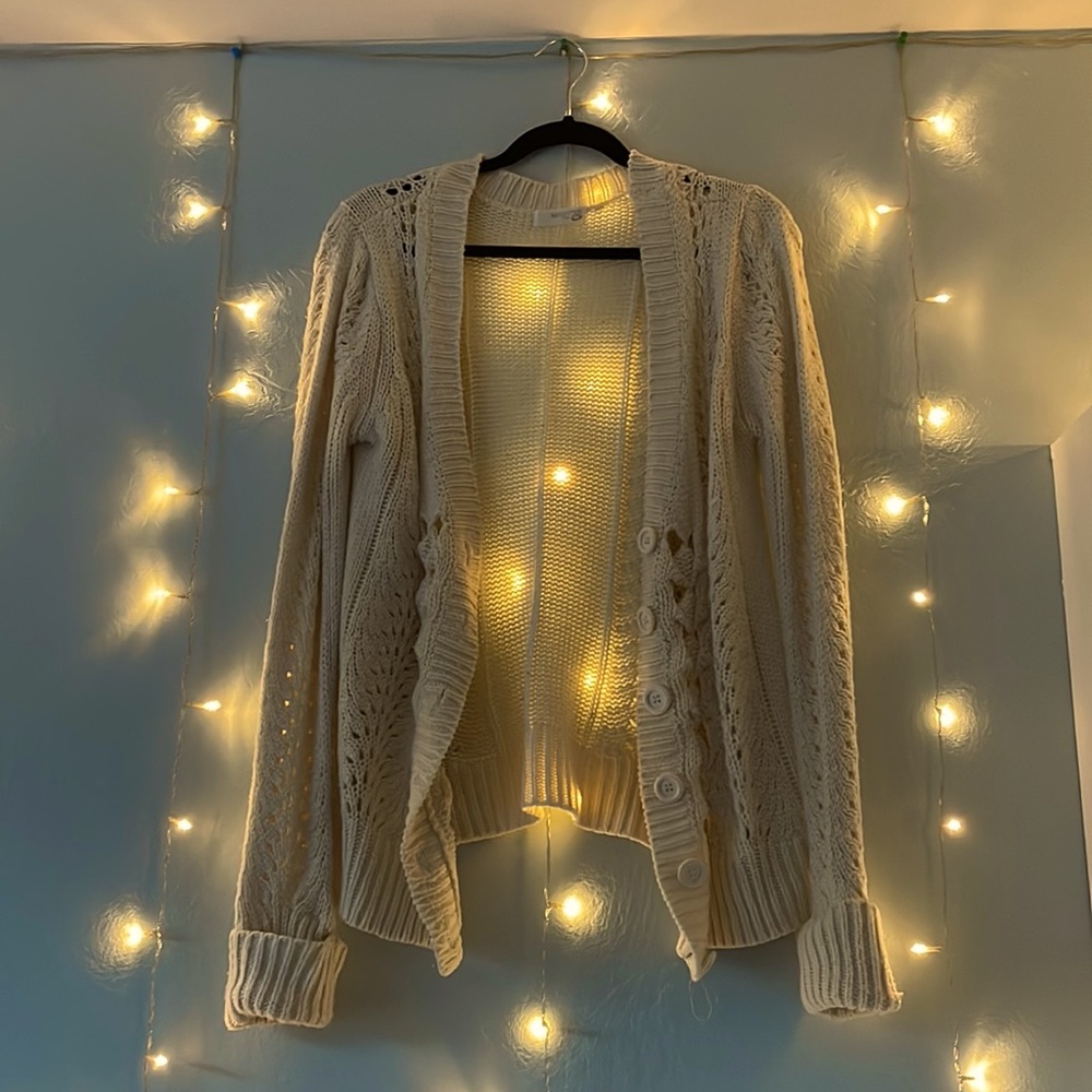 A cream colored cardigan